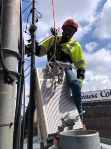 Satellite technician repairing equipment -360 Rope Access