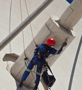 Satellite PPM Maintenance Hartebeespoort rope access worker completing maintenance and painting at height