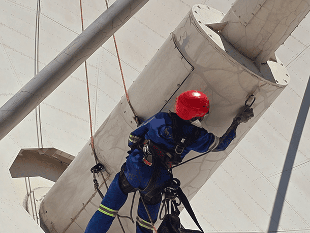 Satellite PPM Maintenance Hartebeespoort rope access worker completing maintenance and painting at height