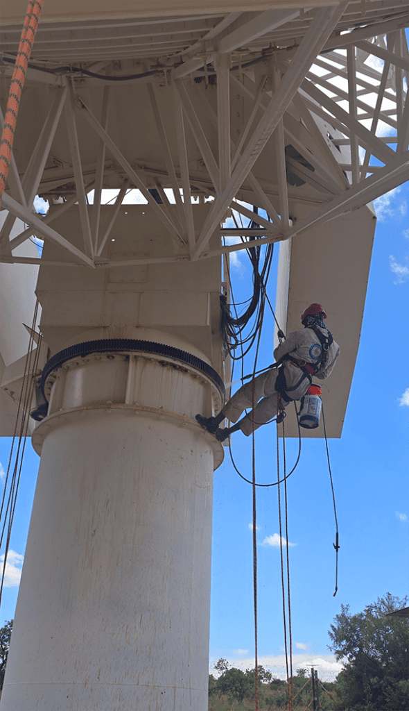 Satellite PPM Maintenance Hartebeespoort rope access technician treating rust on satellite infrastructure