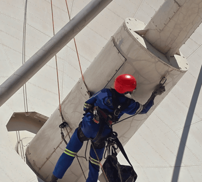 Satellite PPM Maintenance Hartebeespoort rope access worker completing maintenance and painting at height
