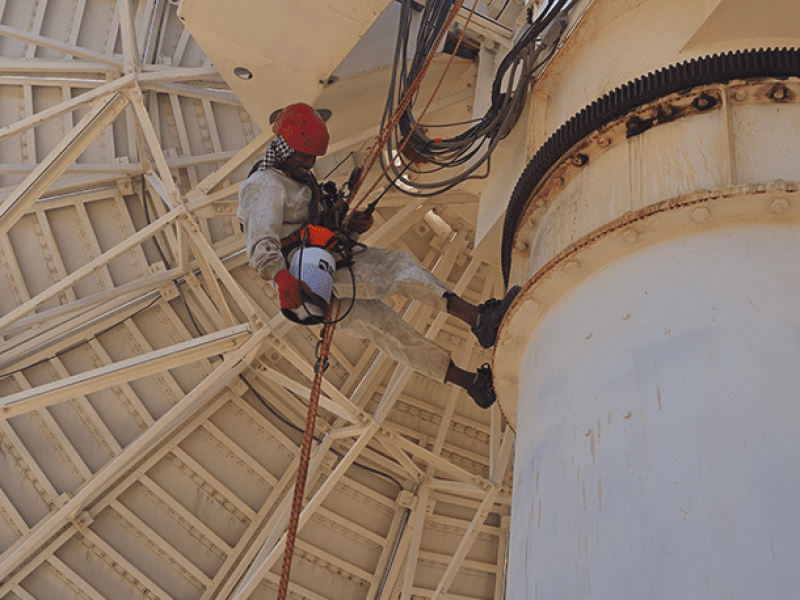 Satellite PPM Maintenance Hartebeespoort technician performing rust maintenance on satellite structure