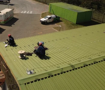 fall protection systems Johannesburg installation work with cable and roof-mounted hardware