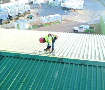 lifeline installation Roodepoort technician adjusting roof-mounted lifeline component on green metal roof